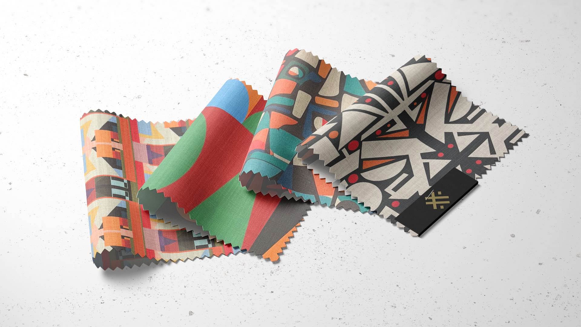 Folded Saint and Poet luxury upholstery fabric swatches showing colour texture and print detail