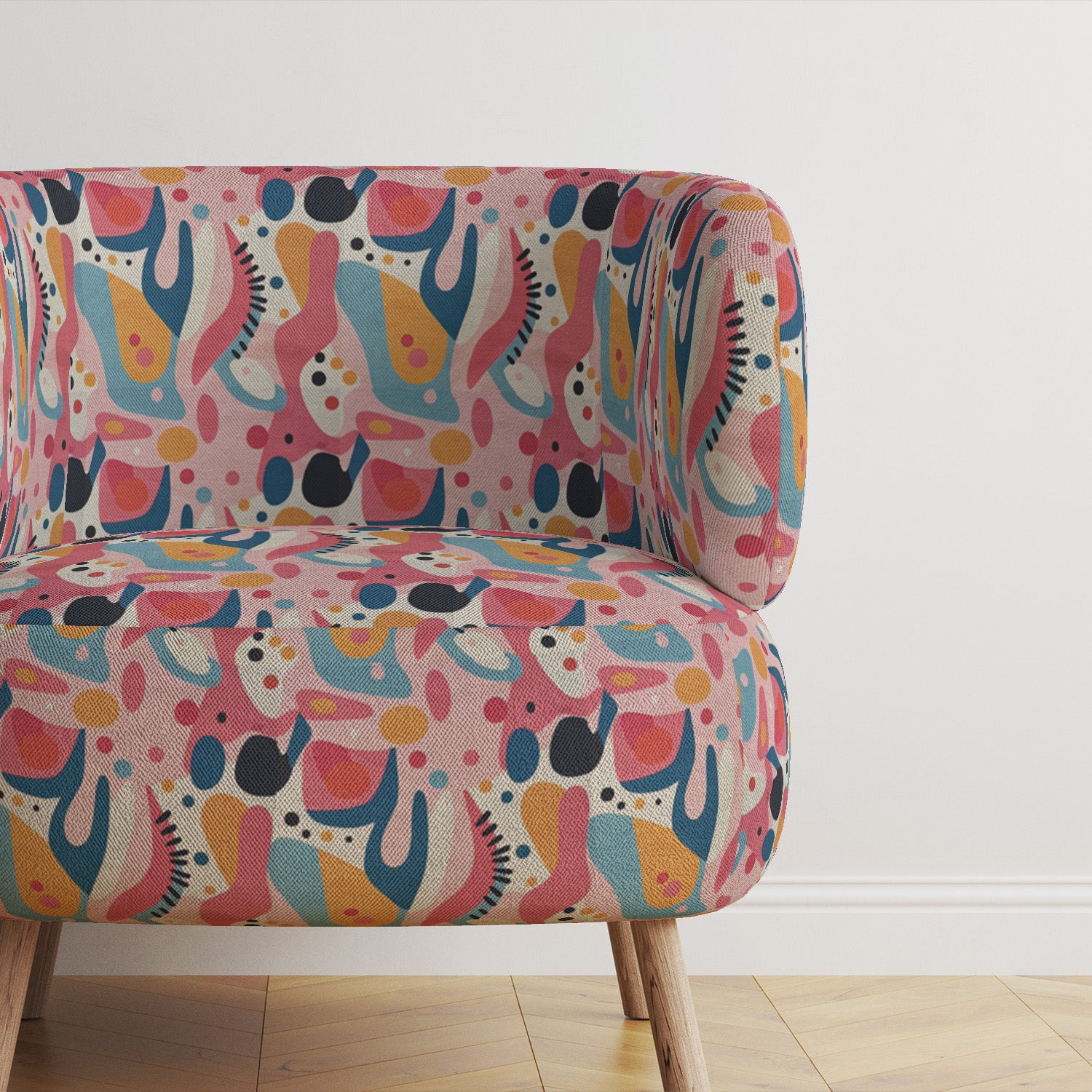 Statement chair upholstered in colorful abstract pattern fabric