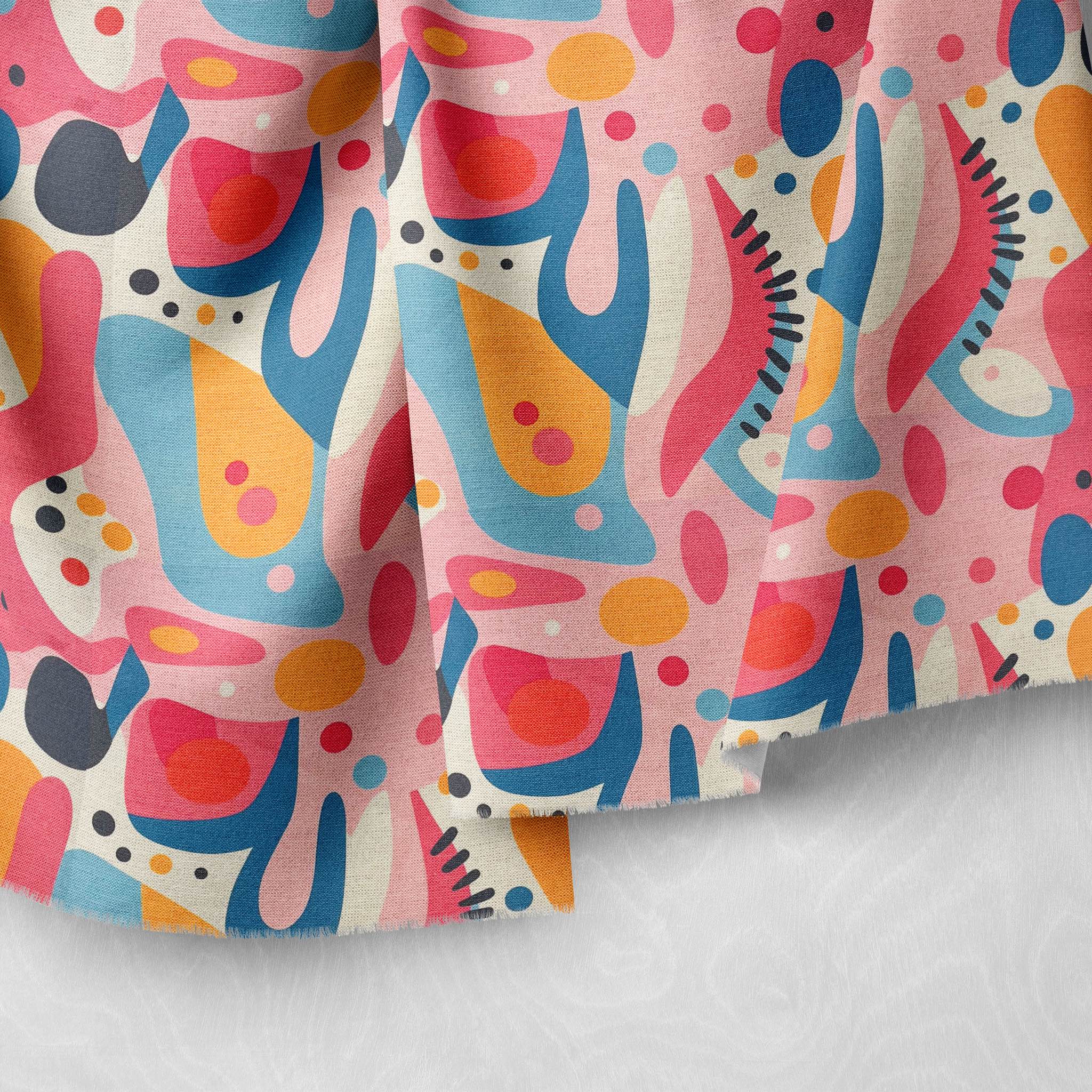 Modern abstract upholstery fabric in pink, blue, coral, and gold