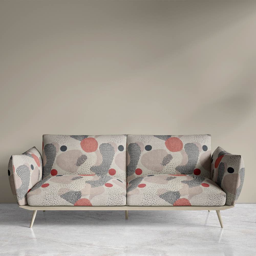 A modern sofa upholstered in Abstract No.8 fabric, showcasing its sophisticated neutral and warm earthy tones with expressive pattern detailing.