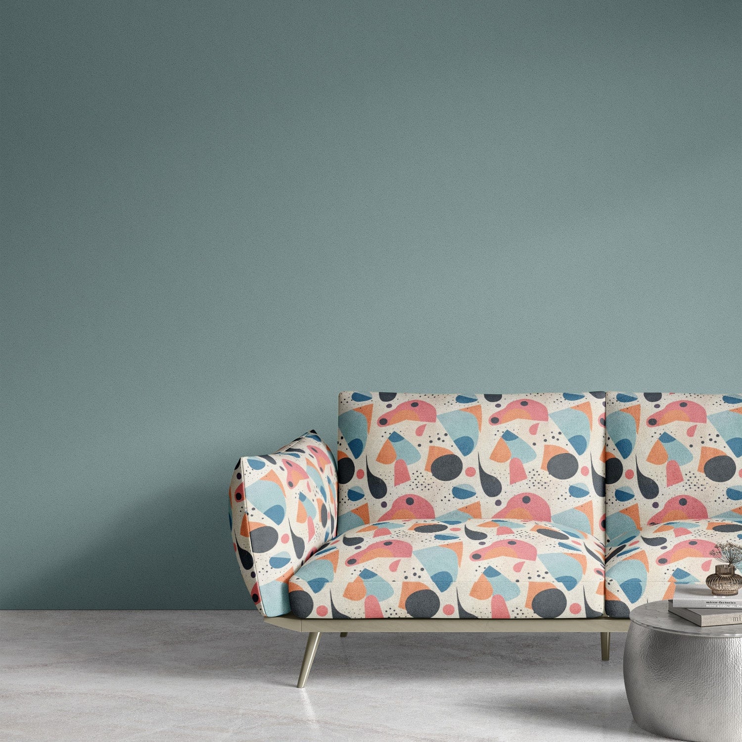 “A contemporary sofa upholstered in Abstract No.9 fabric, showcasing a dynamic mix of curves, shapes, and artistic color contrasts.