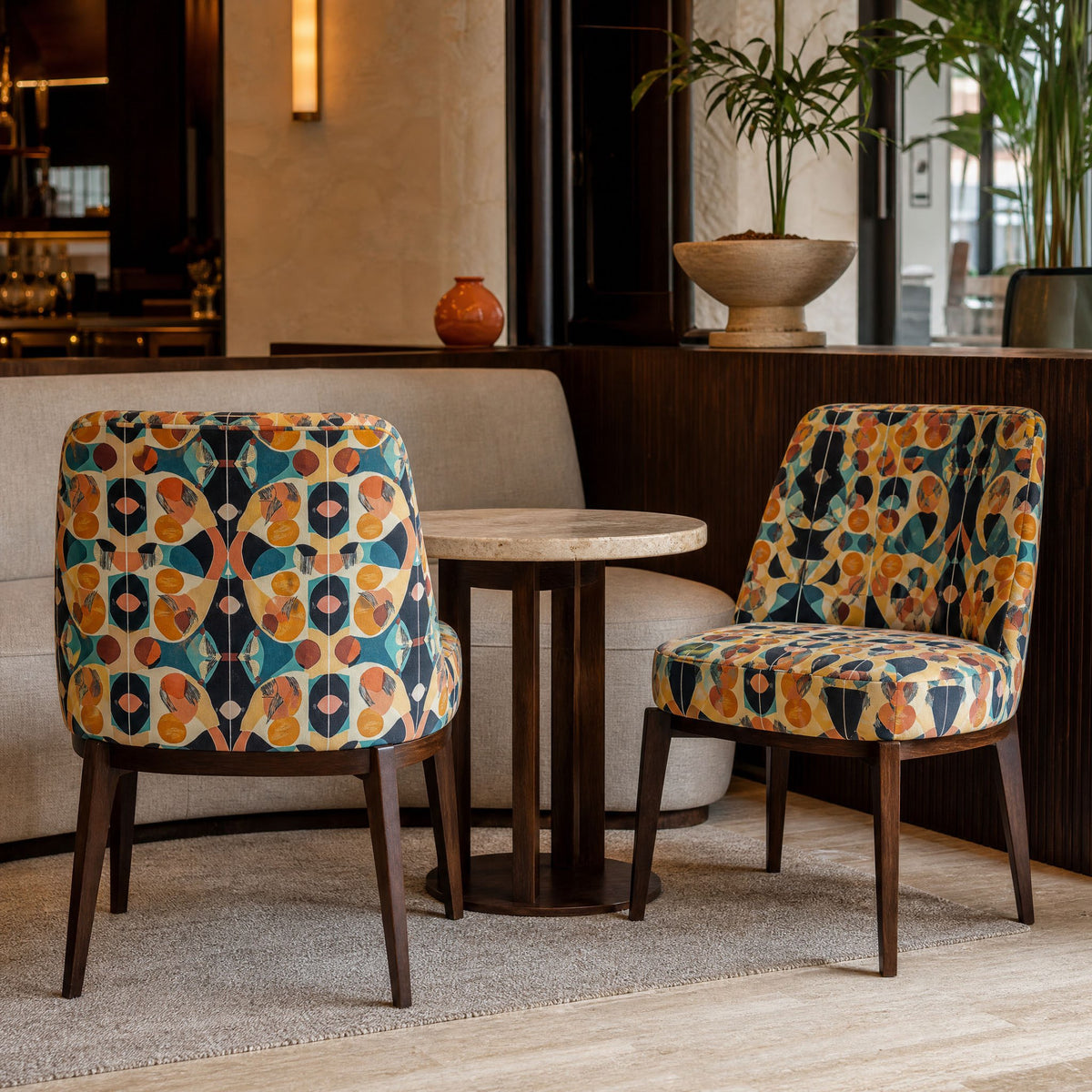Pair of chairs upholstered in Abstract No.14 mid-century navy and orange velvet