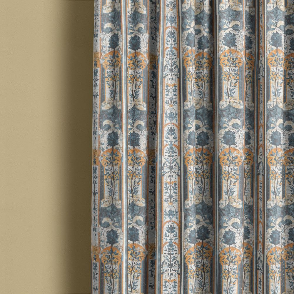 Agra No.3 curtain fabric made into full length curtains showing blue architectural arches and leafy motif