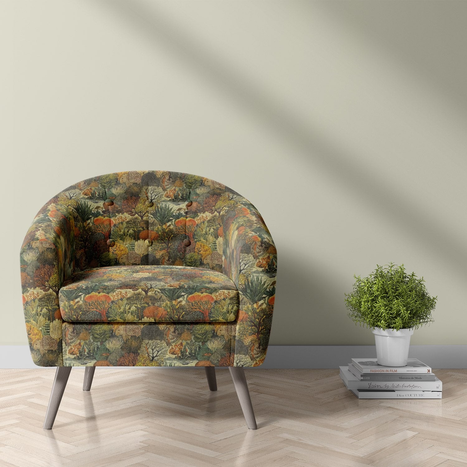 Armchair upholstered in Animals No.6 animal upholstery fabric featuring jungle trees and animals in rich green hues