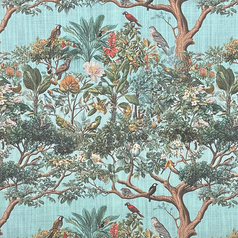 Traditional style upholstery fabric featuring colourful birds, tropical foliage, flowering plants and botanical landscape on a soft blue background