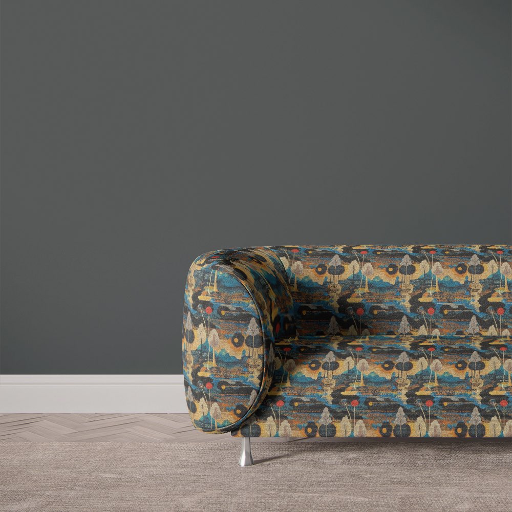 Upholstered sofa in Arcadia No.2 black scenic upholstery fabric featuring moody abstract trees and layered design elements.