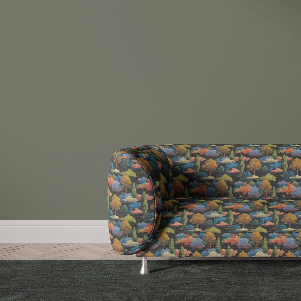 Armchair upholstered in Arcadia No.4 black upholstery fabric with bold surreal landscape design