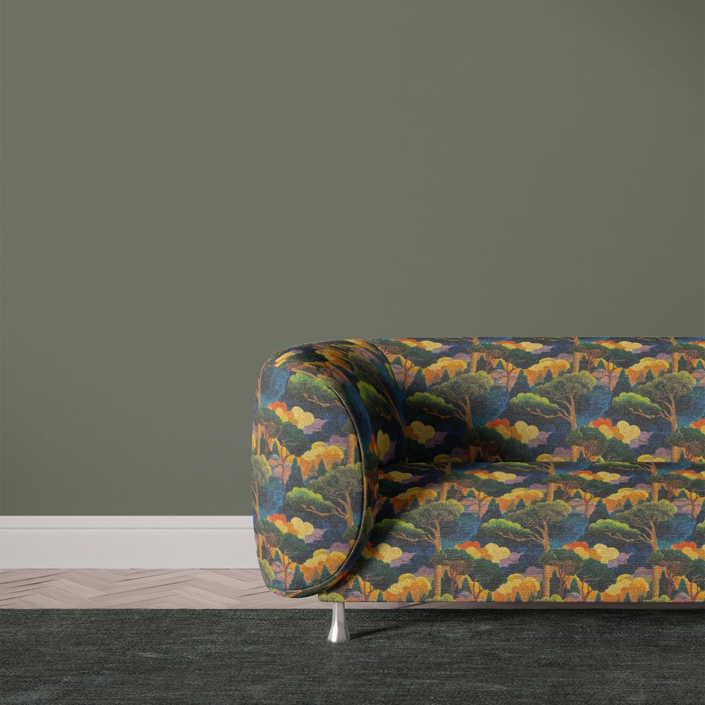 Sofa upholstered in Arcadia No.6 upholstery fabric featuring bold landscape motifs and rich multicoloured tones