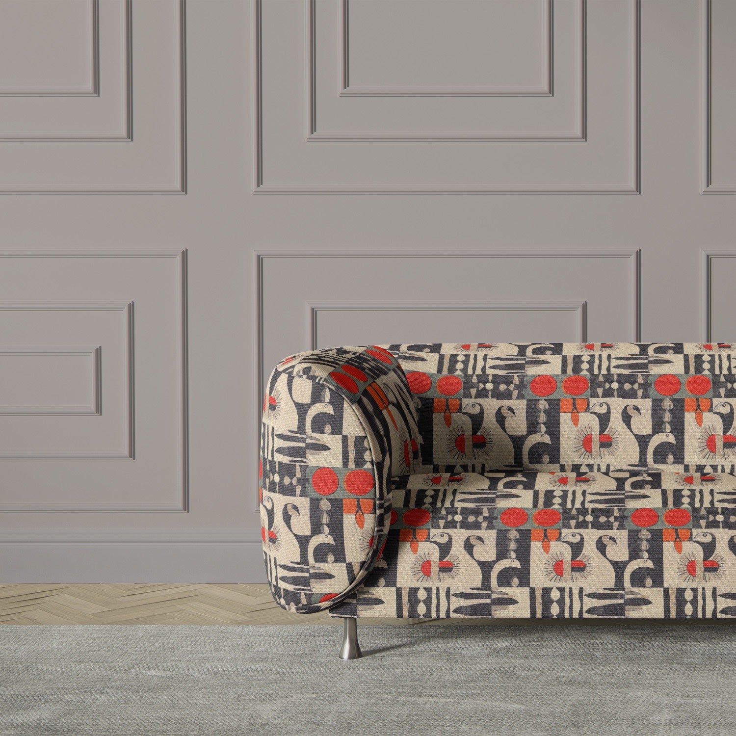 Modern armchair upholstered in Atelier No.12 fabric, featuring bold geometric birds and red accents