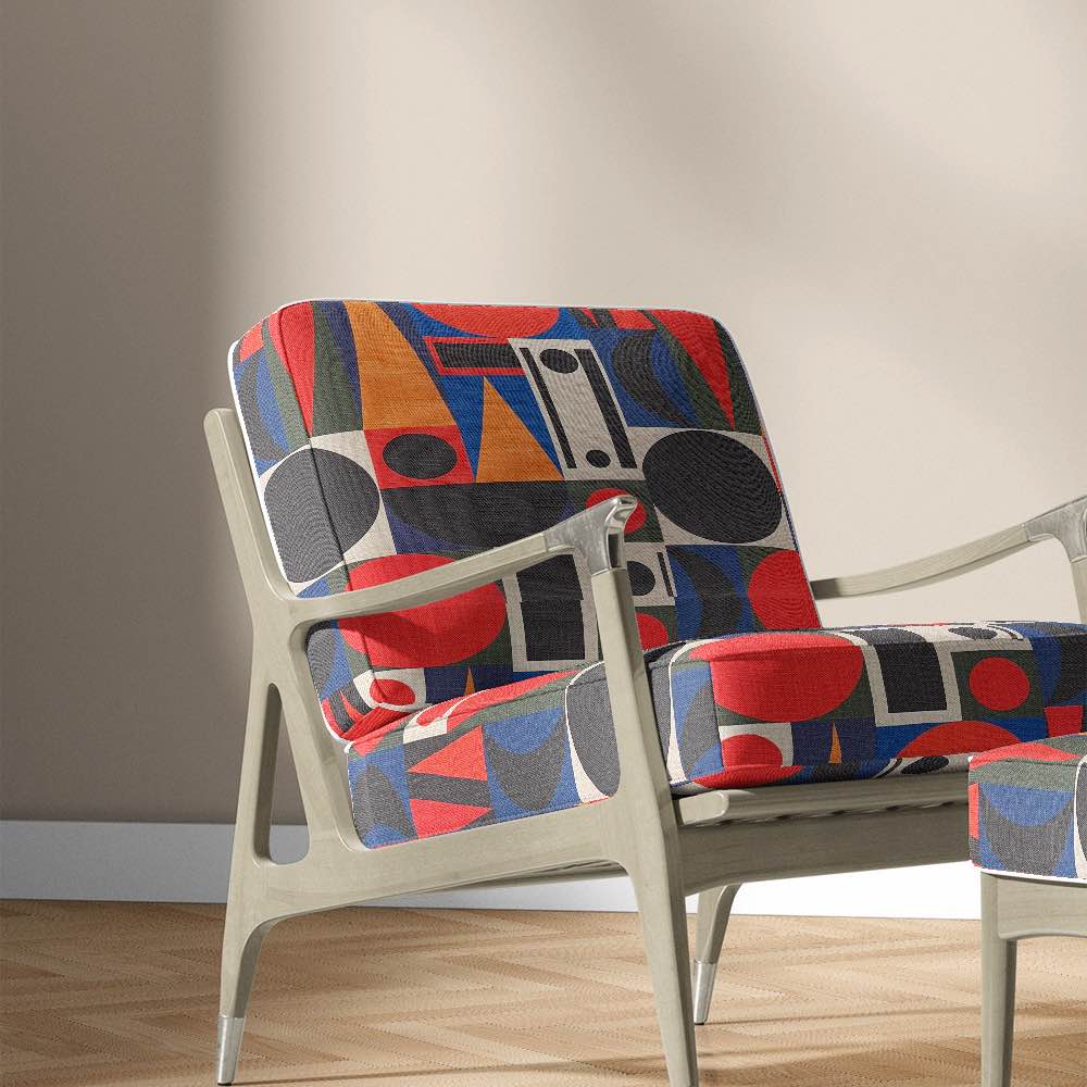 Modern accent chair upholstered in Avant No.10 fabric featuring cubist geometric design