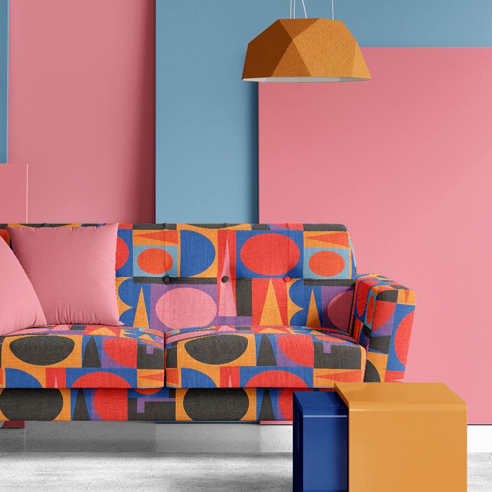 Statement sofa upholstered in Avant No.18 colourful upholstery fabric – bold abstract shapes in a cubist-inspired interior