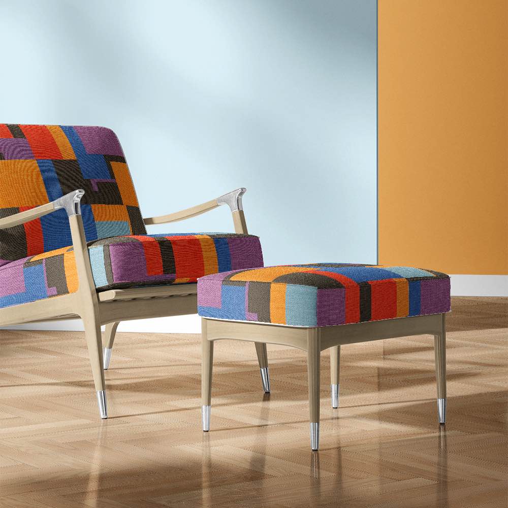 Accent chair upholstered in Avant No.19 bold geometric upholstery fabric in vibrant block colours – modern designer interior look