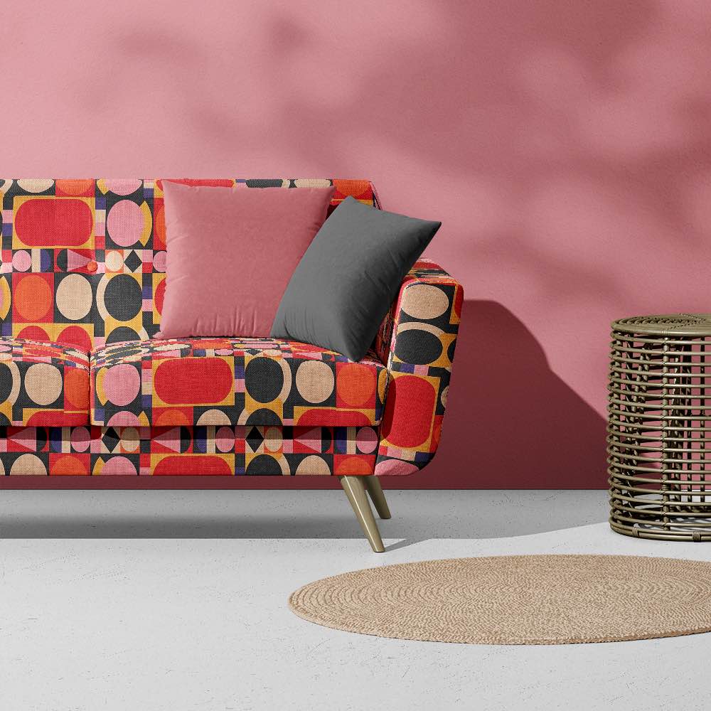 Designer armchair upholstered in Avant No.4 cubist fabric – abstract upholstery fabric for bold interiors.