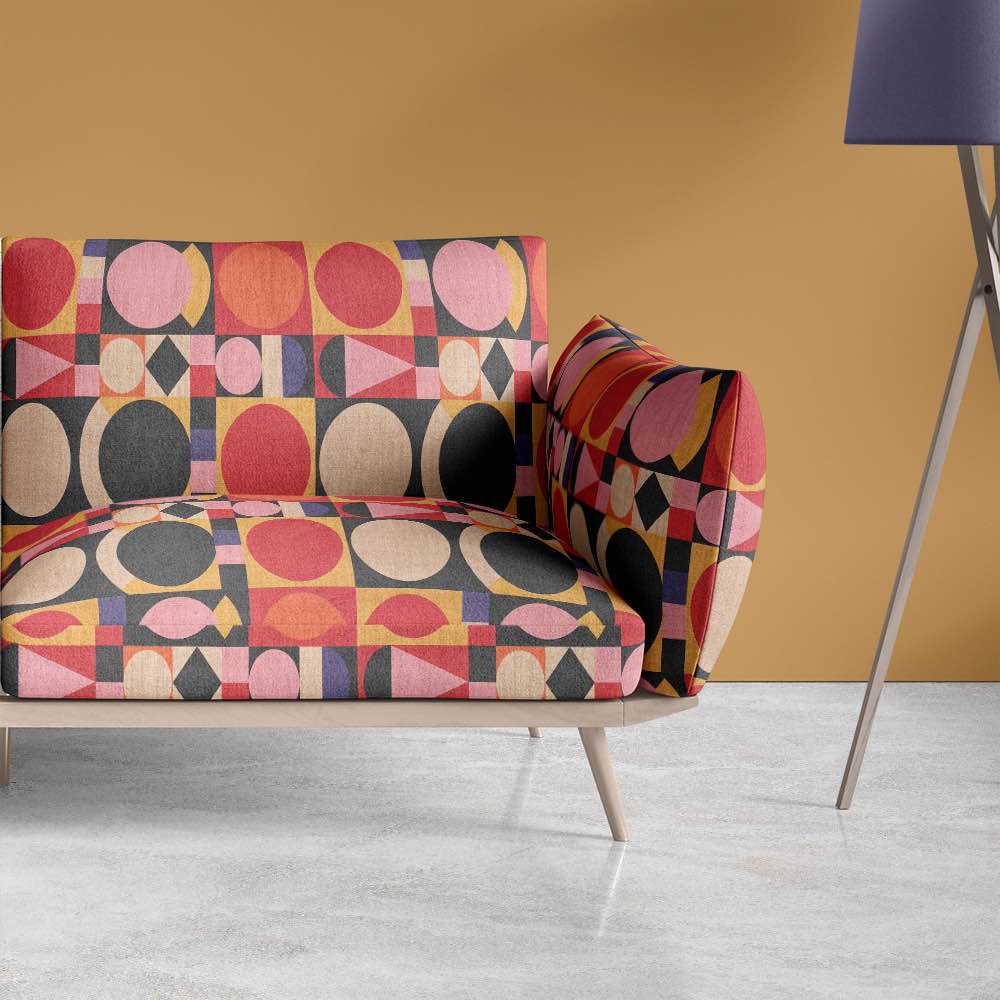 Interior setting featuring a statement sofa upholstered in Avant No.5 bold geometric textile, styled in contemporary living room