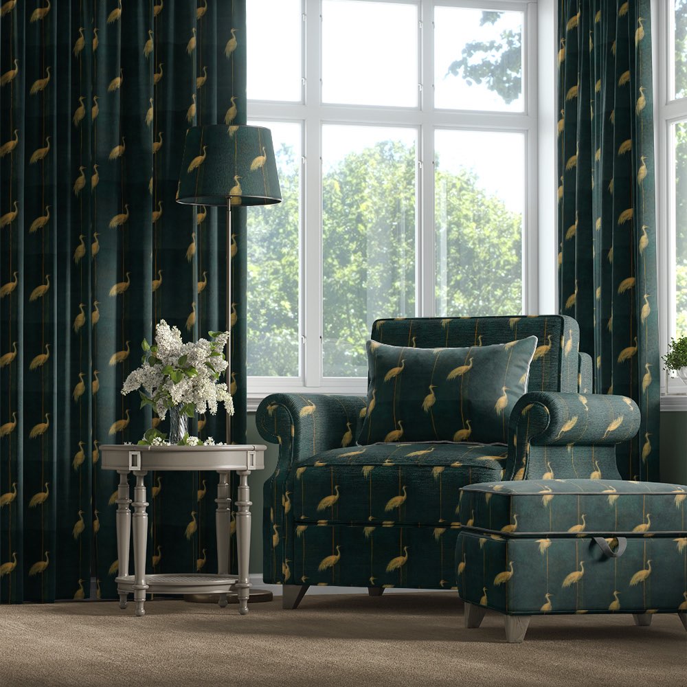 Velvet bird fabric used on armchair, curtains and ottoman featuring golden heron pattern on dark green velvet – Aviary No.2 velvet bird fabric