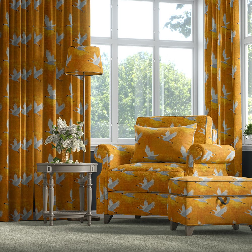 Velvet bird fabric used on armchair, ottoman and curtains with flying crane motif on ochre velvet – Aviary No.7 velvet bird fabric