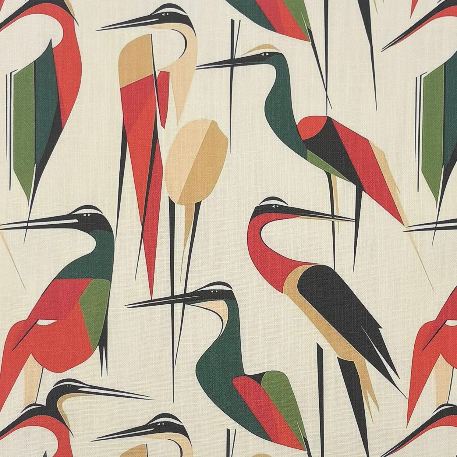 Bird curtain fabric with stylised long bird motifs in red green and neutral tones printed on textured linen fabric