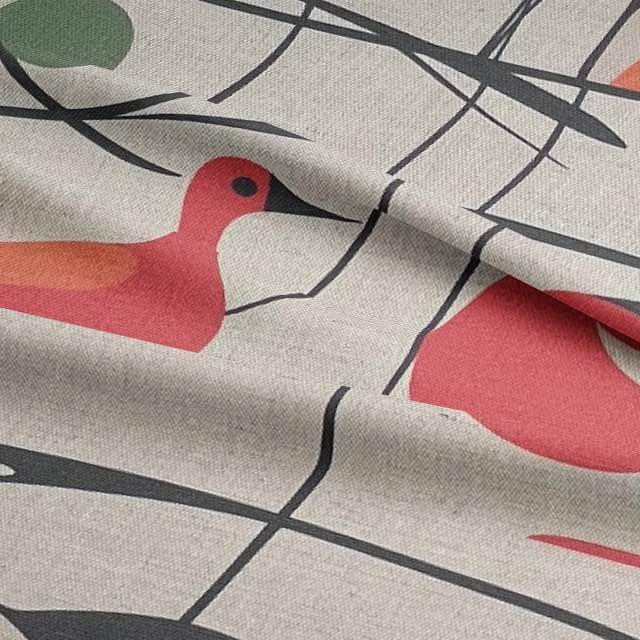 Folded view of Bird No.14 upholstery fabric showing coral birds and branch detail
