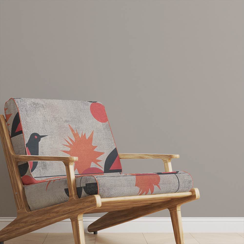Armchair upholstered in Bird No.20 bird fabric in grey and burnt orange