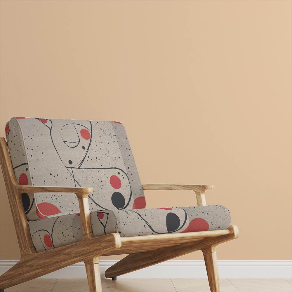 Armchair upholstered in Bird No.6 fabric in a modern living room