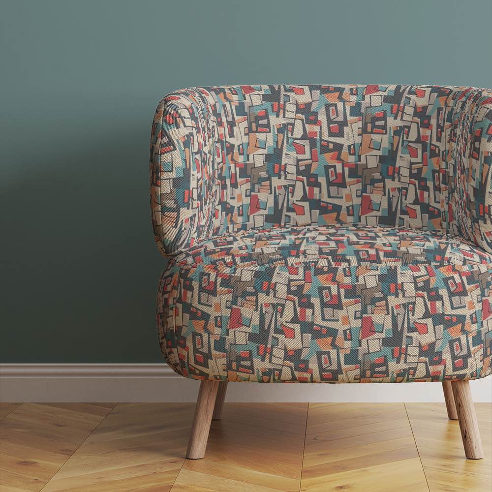 modern-accent-chair-upholstered-in-collage-no-3-fabric-with-abstract-rectangular-patterns-in-bold-muted-tones