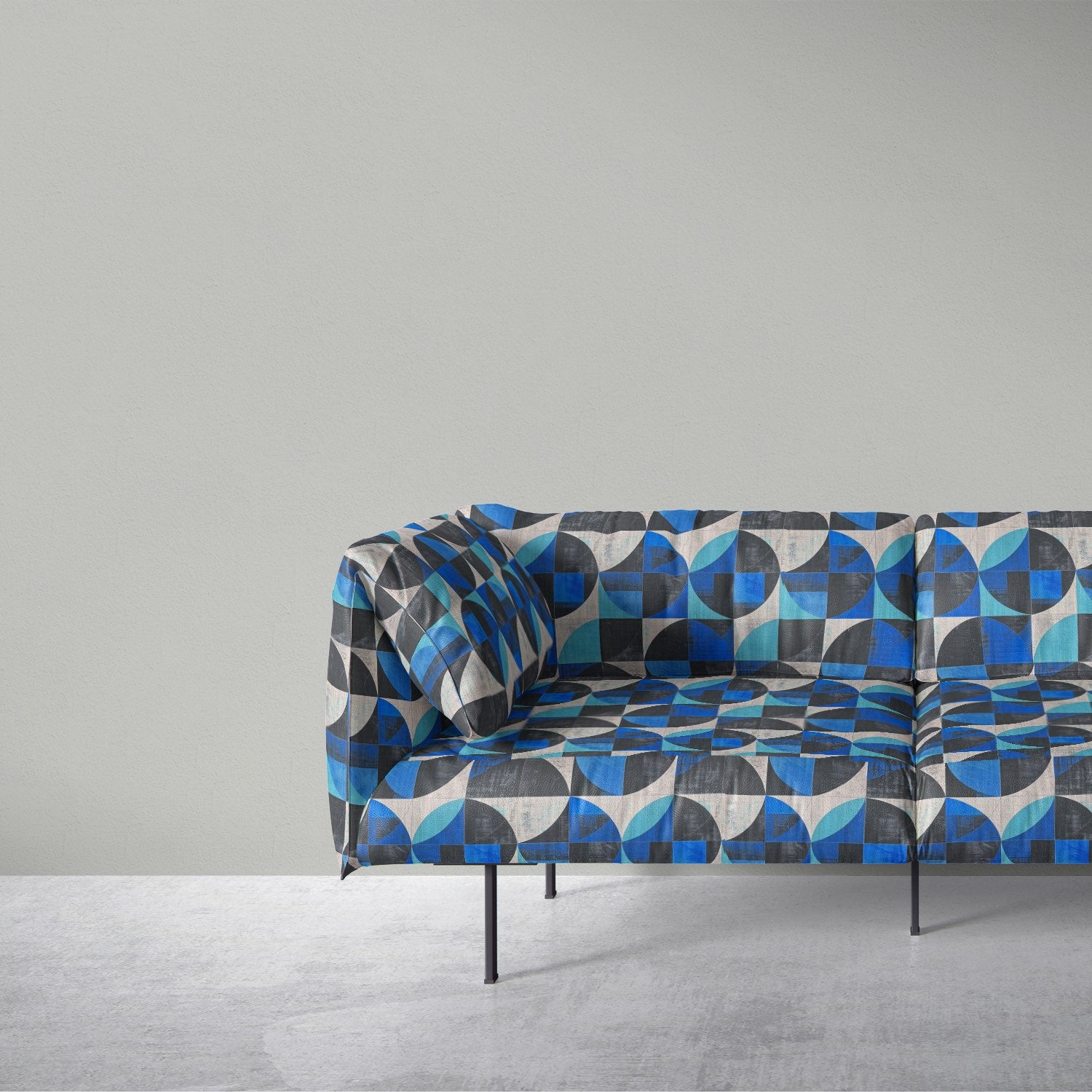 Creation No.10 bold blue and charcoal geometric patterned upholstery fabric on modern sofa