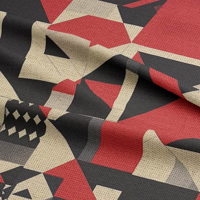 Close-up of Creation No.6 fabric draped – textured luxury upholstery fabric with Bauhaus-style blocks in red, black and neutral tones