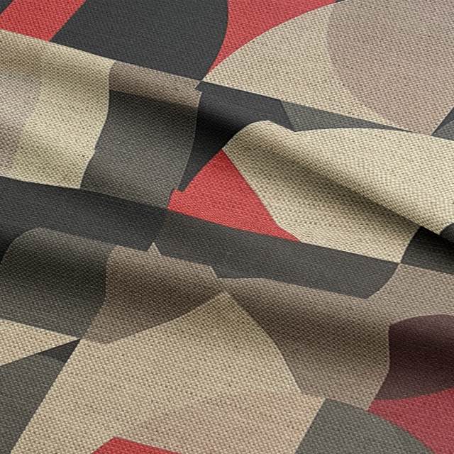 Close-up of soft luxury upholstery fabric featuring curved geometric pattern in deep red, neutral taupe, and charcoal on flax base