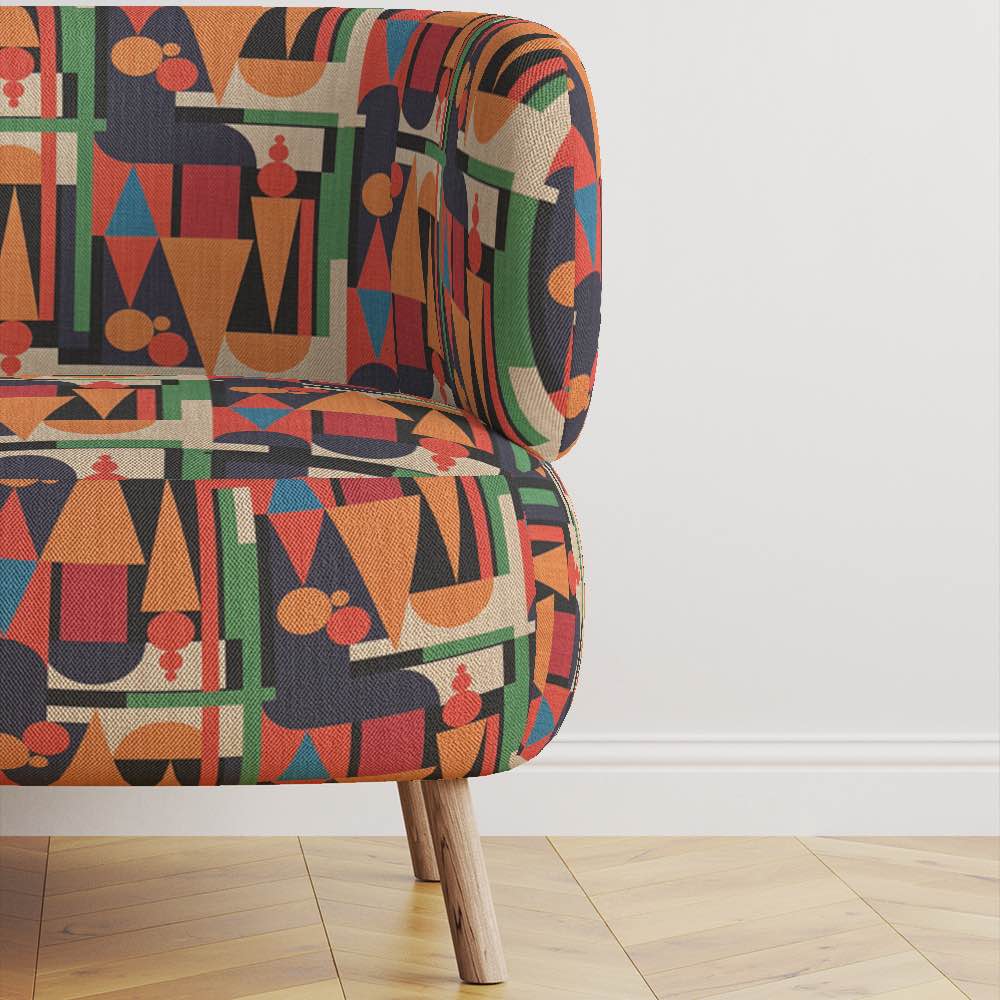 Statement armchair upholstered in Cubism No.13 fabric in colourful modern interior