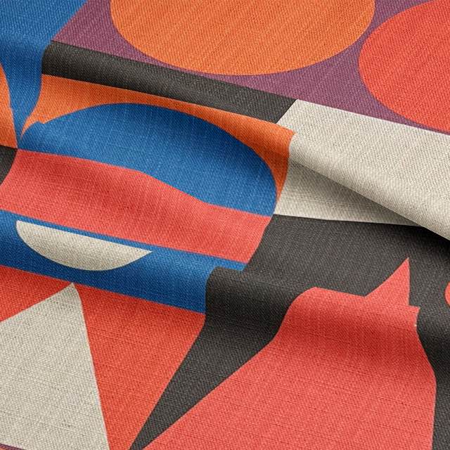 Draped Cubism No.14 fabric showing bold triangle and circle pattern in vivid colours