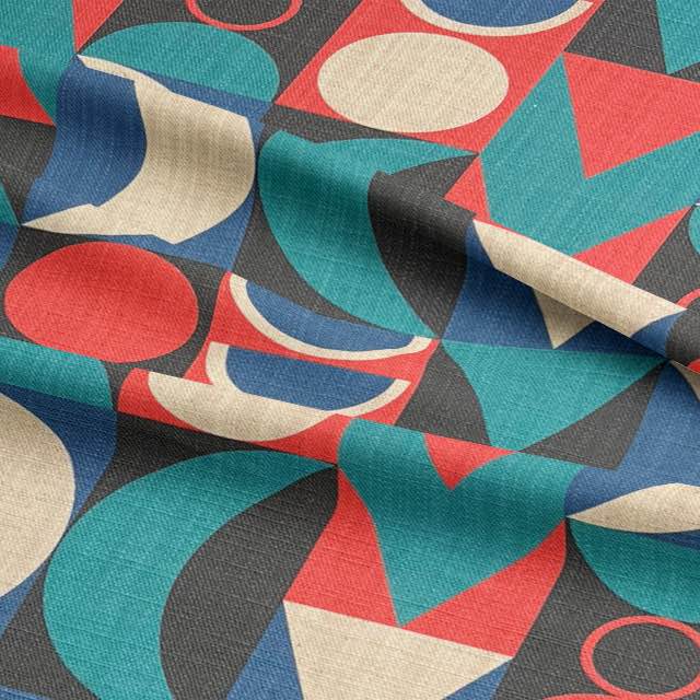Close-up detail of Cubism No.4 designer upholstery fabric revealing bold red circles, teal triangles and ivory crescents on woven textile