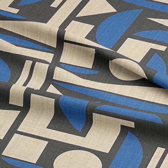 Close-up fabric fold of Cubism No.7 designer textile revealing bold black lines, abstract blue forms and soft ivory background