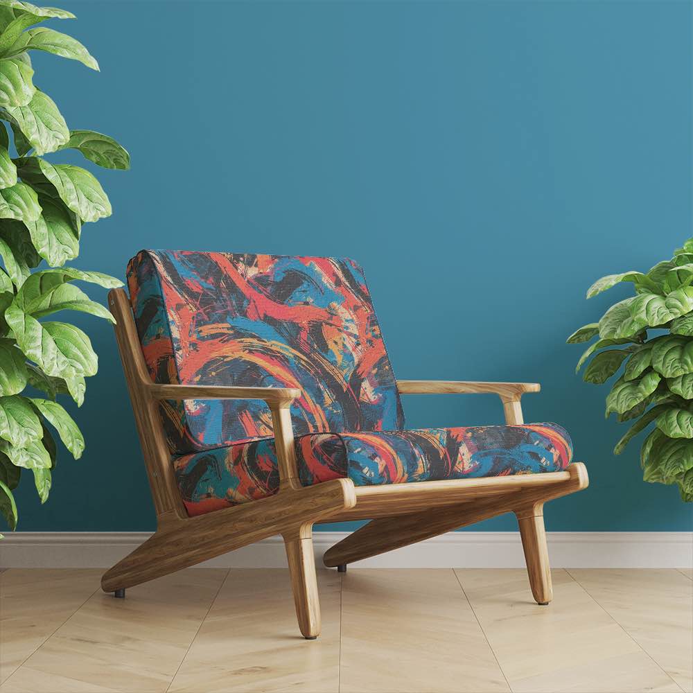 Upholstered chair in Dash No.2 fabric with expressive brushstroke print, styled against teal wall and hardwood floor