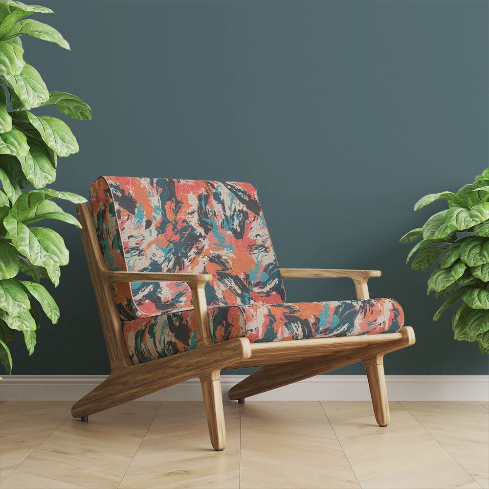 Modern armchair upholstered in Dash No.6 painterly fabric, styled in a deep green interior