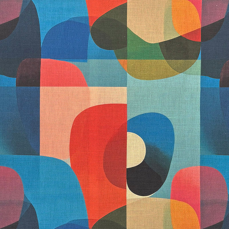 Multicoloured abstract geometric upholstery fabric – close-up of Dessau No.6 print with red, blue, orange, and green shapes.