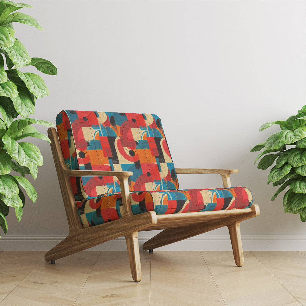 Armchair upholstered in Dessau No.8 multicoloured upholstery fabric with vibrant geometric shapes