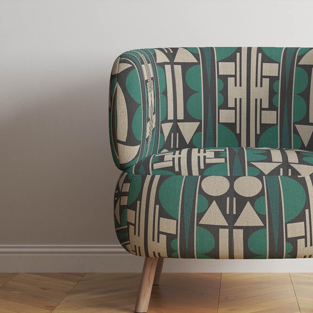 Accent chair upholstered in Estaque No.13 geometric fabric with bold black and green vertical lines