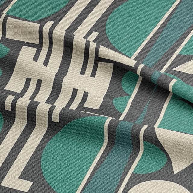 Close-up of Estaque No.13 upholstery fabric showing architectural cubist pattern in deep green and charcoal