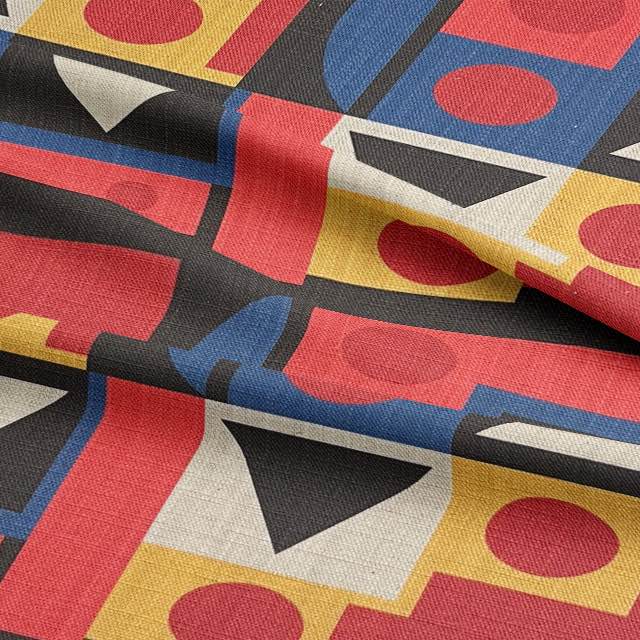 Close-up of luxury linen-blend fabric in Estaque No.1 with geometric red, black, and yellow print