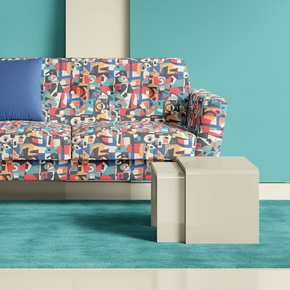 Modern sofa upholstered in Exhibite No.10 designer luxury fabric styled in a teal interior with sculptural furniture and artistic decor