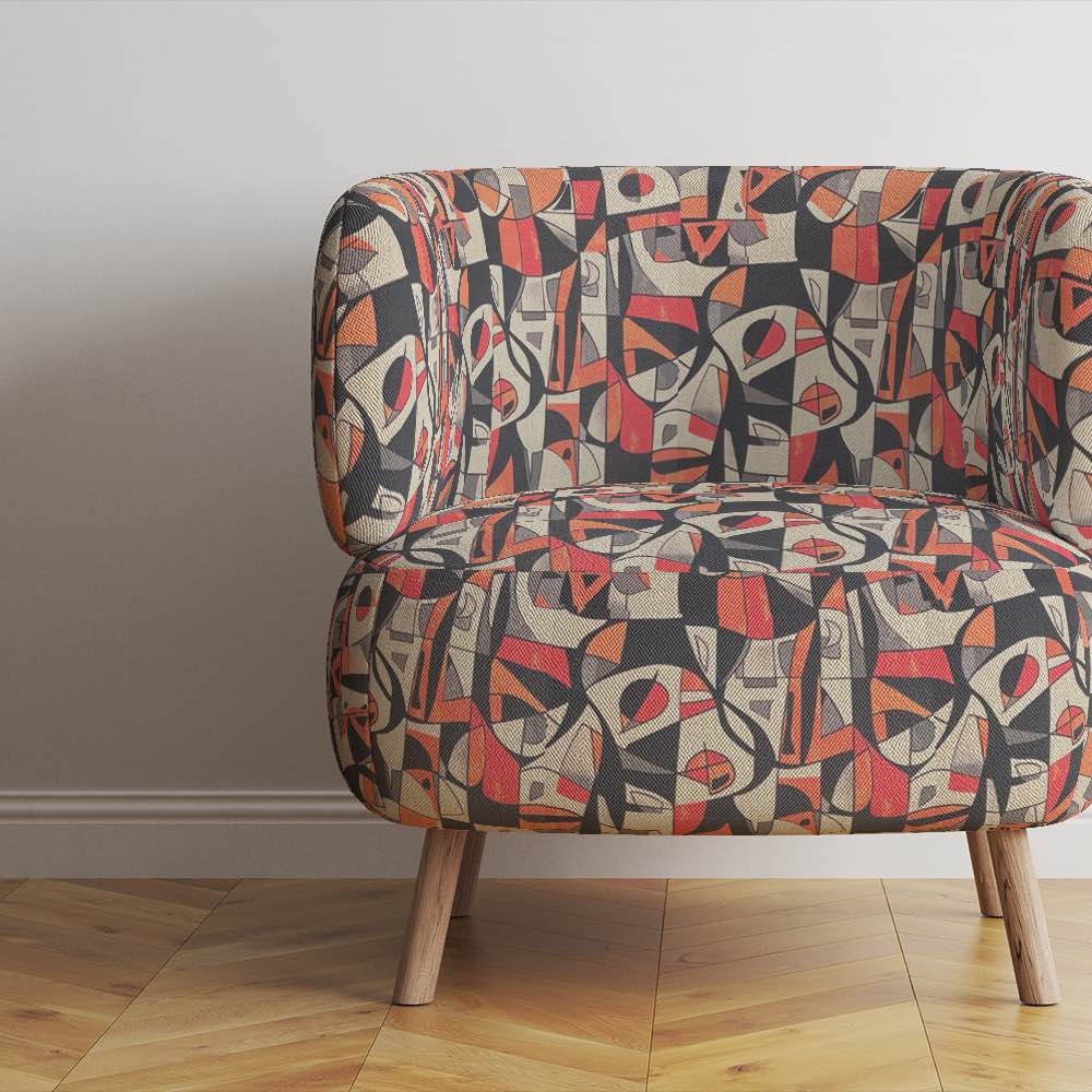 Modern accent chair upholstered in Exhibite No.14 red and orange geometric design