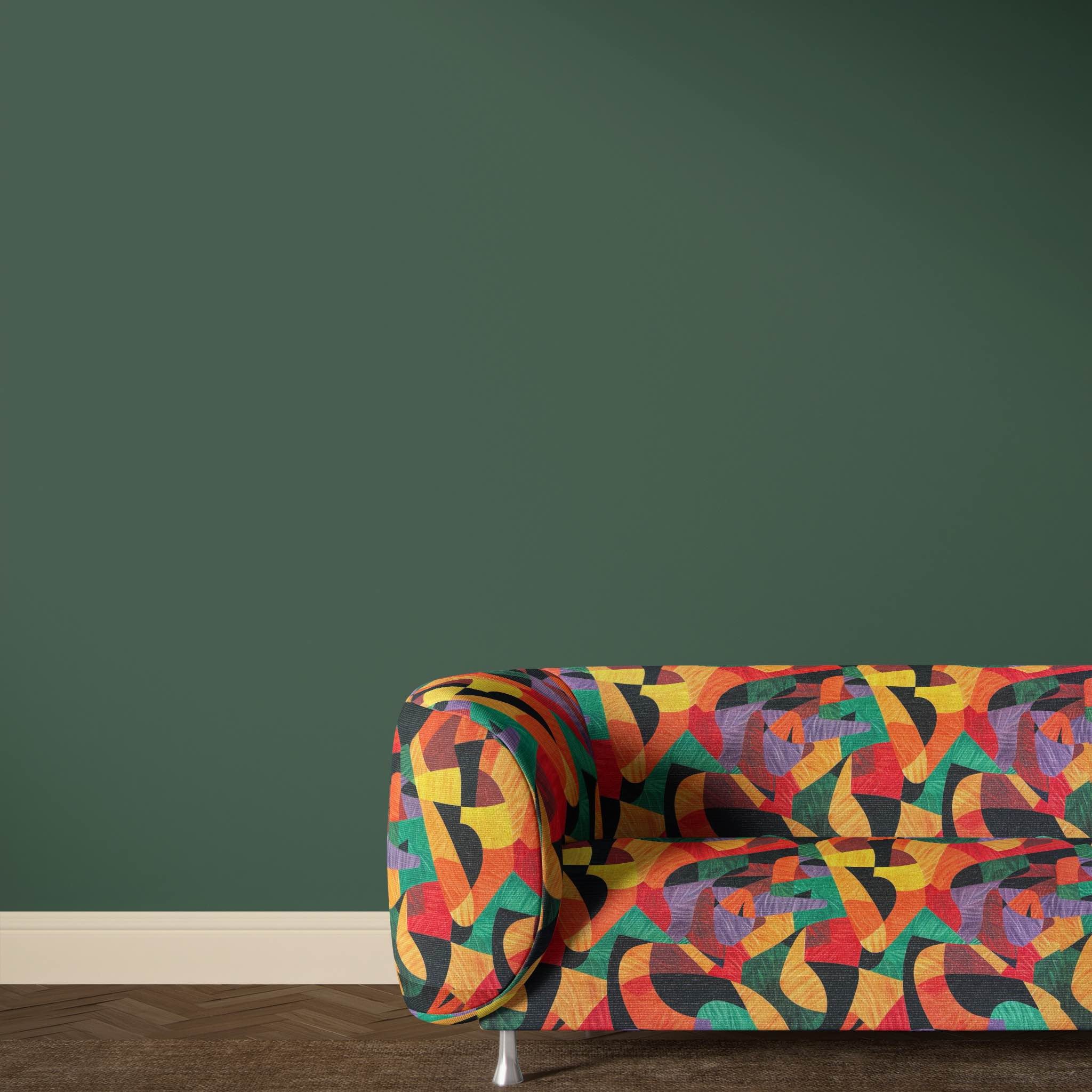 Statement armchair upholstered in Exhibite No.4 fabric, showcasing bold multicoloured artistic pattern
