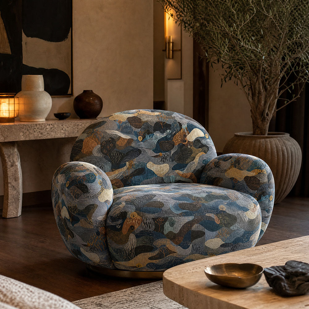 Fauve No.14 multicoloured abstract upholstery fabric on a statement chair in a bold contemporary room