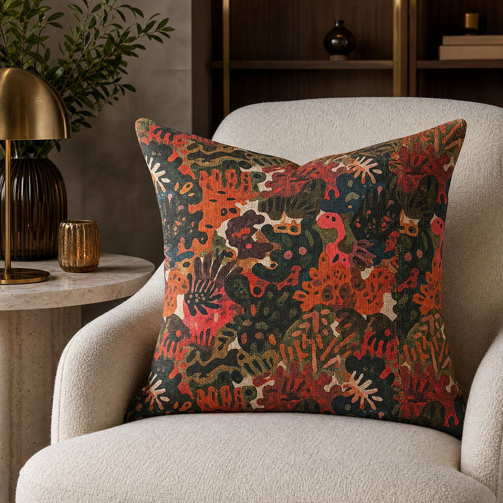 Fauve No.18 coral pink and orange abstract upholstery fabric on a scatter cushion