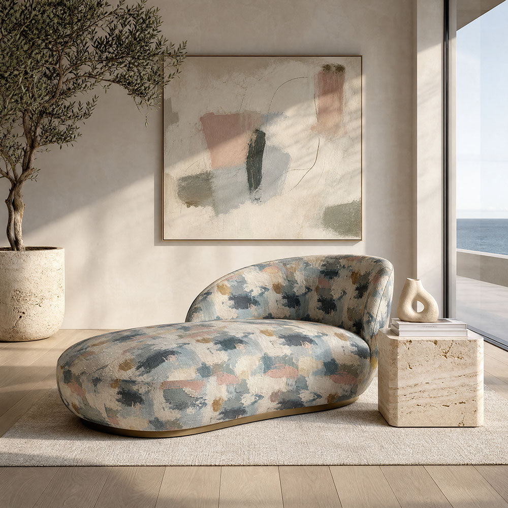 Fauve No.3 blue and pink abstract upholstery fabric on a chaise lounge in a refined neutral interior