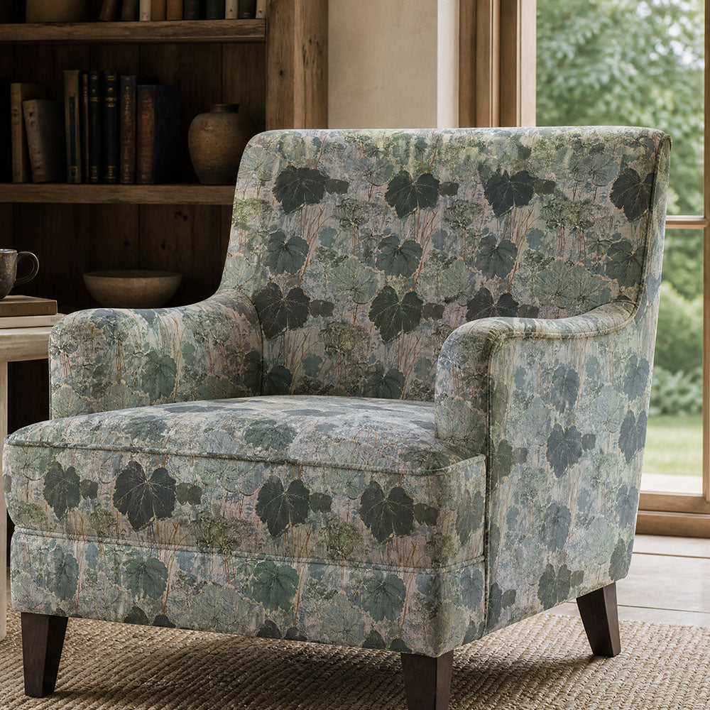 Foliage Leaf No.2 sage green botanical upholstery fabric shown on an elegant accent chair