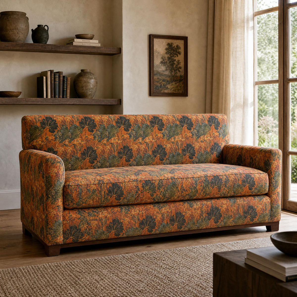 Foliage Leaf No.7 burnt orange botanical upholstery fabric shown on a statement sofa