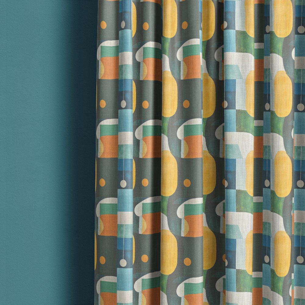 Fresco No.5 curtain fabric made into curtains featuring multicoloured geometric shapes on deep green background