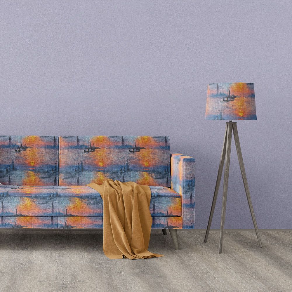 Giverny No.1 impressionist style upholstery fabric on a sofa and matching lampshade with blue, purple, orange and gold sunset scene