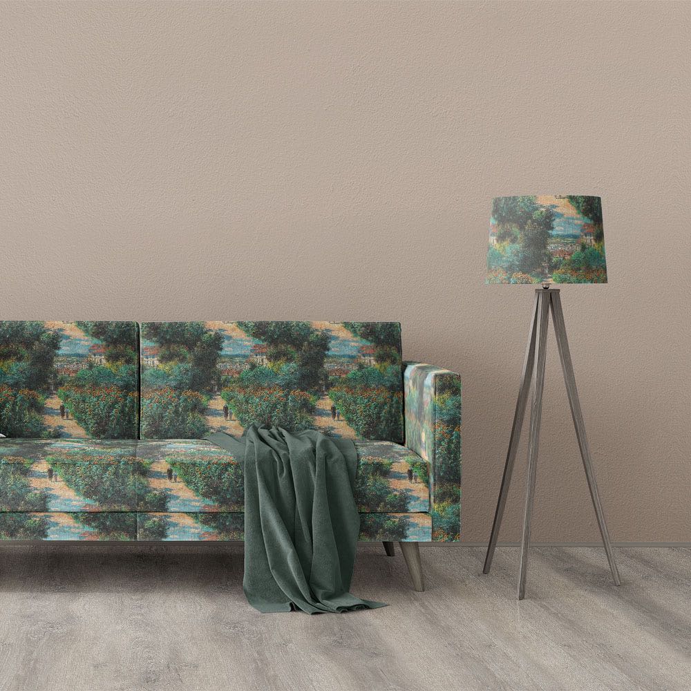 Giverny No.3 impressionist style upholstery fabric displayed on sofa and lampshade with scenic garden landscape in green, blue and golden tones